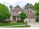 Charming home featuring red shutters, well-manicured lawn, and a two-car garage, set in a beautiful neighborhood at 629 Peach Orchard Pl, Cary, NC 27519