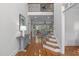 Elegant hallway featuring hardwood floors, staircase, and an open view to the living room at 629 Peach Orchard Pl, Cary, NC 27519