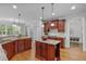 Gourmet kitchen boasts stainless appliances, granite counters and a central island at 629 Peach Orchard Pl, Cary, NC 27519