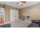 Comfortable room featuring a black leather sofa and a white bookcase at 629 Peach Orchard Pl, Cary, NC 27519