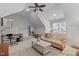 Bright, airy living room with sloped ceilings, a workspace, and comfortable seating area at 629 Peach Orchard Pl, Cary, NC 27519