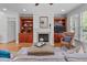Comfortable living room with fireplace, built-in cabinets, and plush seating at 629 Peach Orchard Pl, Cary, NC 27519