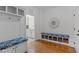 Mud room with built-in storage and seating with hooks and cubbies at 629 Peach Orchard Pl, Cary, NC 27519