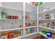 Walk-in pantry boasts plenty of shelving and space for storing food and supplies at 629 Peach Orchard Pl, Cary, NC 27519