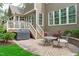 Brick patio with seating area and a fountain, ideal for outdoor entertaining and relaxation at 629 Peach Orchard Pl, Cary, NC 27519