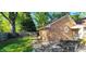 Brick home featuring a patio and outdoor dining set in a private backyard at 704 W Front St, Burlington, NC 27215