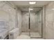 A bathroom showcasing a glass-door shower and white marble tiling at 704 W Front St, Burlington, NC 27215