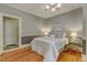 A bedroom with hardwood floors and comfortable decor at 704 W Front St, Burlington, NC 27215