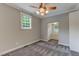 A bedroom is shown with carpet flooring and a walk-in closet at 704 W Front St, Burlington, NC 27215