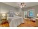 A bedroom with hardwood floors and comfortable decor at 704 W Front St, Burlington, NC 27215