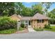 Attractive brick home with tidy landscaping, a gravel driveway, and a walkway to the front door at 704 W Front St, Burlington, NC 27215