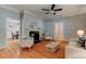 Cozy living space featuring a fireplace, hardwood floors, and elegant furnishings at 704 W Front St, Burlington, NC 27215