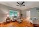 Bright living room with hardwood floors, neutral walls, and a view to the outside at 704 W Front St, Burlington, NC 27215