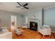 Inviting living room featuring hardwood floors, fireplace, and neutral color palette at 704 W Front St, Burlington, NC 27215
