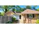 Brick home with side entrance, manicured landscape, and inviting pathway at 704 W Front St, Burlington, NC 27215