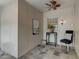 Cozy sunroom featuring neutral walls, slate tile flooring, a ceiling fan, and natural light at 704 W Front St, Burlington, NC 27215