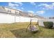 Private backyard with a swing and lawn at 7328 Caversham Way, Raleigh, NC 27617