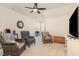 Neutral living room with lots of seating and natural light at 7328 Caversham Way, Raleigh, NC 27617