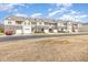 Scenic street view showcasing well-maintained townhomes in a vibrant community at 7328 Caversham Way, Raleigh, NC 27617