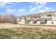 Row of townhomes with varied facades and attached garages, set along a peaceful street at 7328 Caversham Way, Raleigh, NC 27617