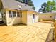 The home has a wooden deck and an outdoor entry door at 7702 Nc Highway 581, Kenly, NC 27542