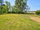 The property features a large backyard at 7702 Nc Highway 581, Kenly, NC 27542