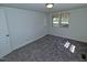 Bedroom with two windows, neutral walls, and new carpet at 7702 Nc Highway 581, Kenly, NC 27542