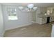 Bright dining room with contemporary lighting and a view of the lawn at 7702 Nc Highway 581, Kenly, NC 27542