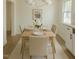 Dining room featuring a modern table setting and natural light from the window at 7702 Nc Highway 581, Kenly, NC 27542