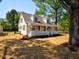 Charming home with a welcoming front porch and mature trees providing ample shade at 7702 Nc Highway 581, Kenly, NC 27542