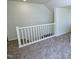Hallway featuring neutral carpet and white railings at 7702 Nc Highway 581, Kenly, NC 27542