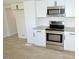 Updated kitchen featuring stainless steel oven and cooktop, granite counters and LVP flooring at 7702 Nc Highway 581, Kenly, NC 27542