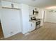 Modern kitchen with stainless steel appliances and white cabinets and new luxury vinyl plank flooring at 7702 Nc Highway 581, Kenly, NC 27542
