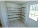 Pantry with ample shelving and tile floors at 7702 Nc Highway 581, Kenly, NC 27542