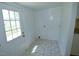 Utility room featuring tile floors, an exterior door and a view of the backyard at 7702 Nc Highway 581, Kenly, NC 27542