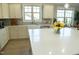 Bright and airy kitchen with a large island, modern appliances, and ample cabinet space for storage at 828 Traditions Ridge Dr, Wake Forest, NC 27587