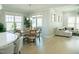 Open-concept living space featuring a dining area and a comfortable living room with lots of natural light at 828 Traditions Ridge Dr, Wake Forest, NC 27587