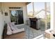 Relaxing screened-in porch with comfortable seating and a cozy fireplace, perfect for year-round enjoyment at 828 Traditions Ridge Dr, Wake Forest, NC 27587
