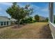 Spacious backyard with mature landscaping and a black metal fence at 833 Gaston Manor Dr, Durham, NC 27703