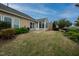 Spacious backyard featuring a well-maintained lawn, a patio area, and a lovely sunroom at 833 Gaston Manor Dr, Durham, NC 27703