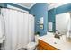 Stylish bathroom with blue walls, a shower, and a vanity at 833 Gaston Manor Dr, Durham, NC 27703