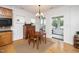 Bright dining area with hardwood floors and access to screened porch at 833 Gaston Manor Dr, Durham, NC 27703