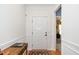 Bright entryway with white wainscoting and a wooden accent table at 833 Gaston Manor Dr, Durham, NC 27703