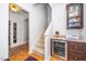 Hallway with stairs, a wine cooler, and view to another room at 833 Gaston Manor Dr, Durham, NC 27703