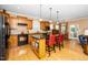 Kitchen featuring an island with bar seating, and stainless steel appliances at 833 Gaston Manor Dr, Durham, NC 27703
