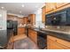Modern kitchen featuring stainless steel appliances and granite countertops at 833 Gaston Manor Dr, Durham, NC 27703