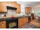 Updated kitchen features stainless steel appliances and stylish backsplash at 833 Gaston Manor Dr, Durham, NC 27703