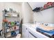 Efficient laundry room includes shelving and modern washer and dryer at 833 Gaston Manor Dr, Durham, NC 27703