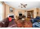Living room with a fireplace, television, and display cabinet at 833 Gaston Manor Dr, Durham, NC 27703