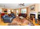 Cozy living room with a fireplace and traditional decor, open to dining area at 833 Gaston Manor Dr, Durham, NC 27703